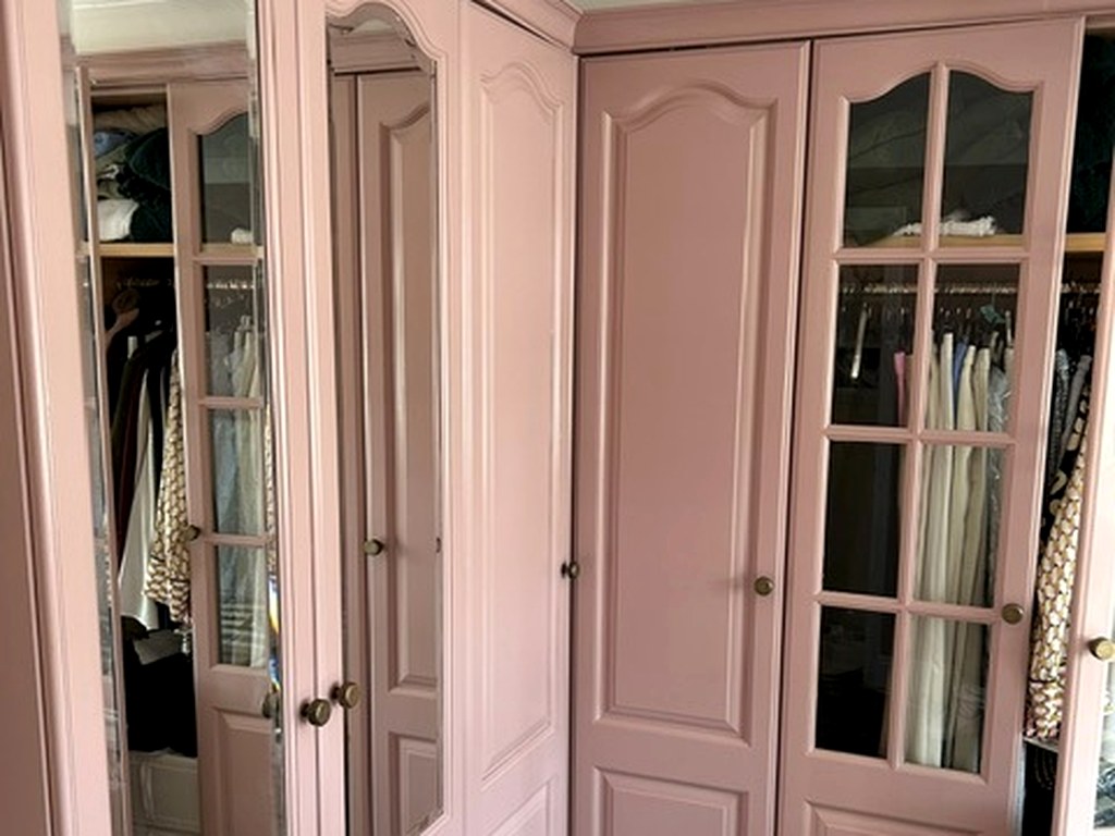 Fitted bedroom wardrobes hand painted in a soft dusky pink finish